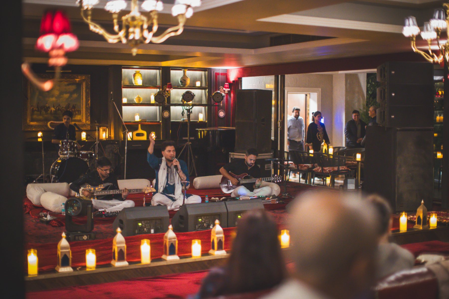 Qawwali vocalist and accompanying musicians performing on stage at The Stable Bar during Auramah Festival 2026