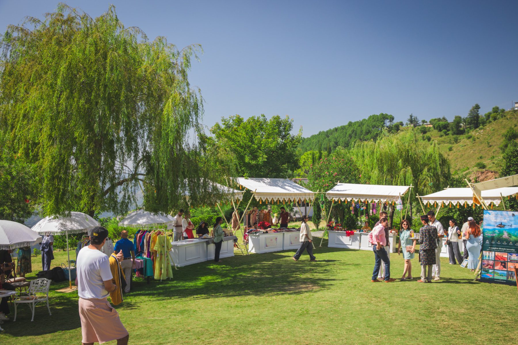 Visitors browsing stalls and handicraft displays at the Valley Bazaar during Auramah Festival 2026